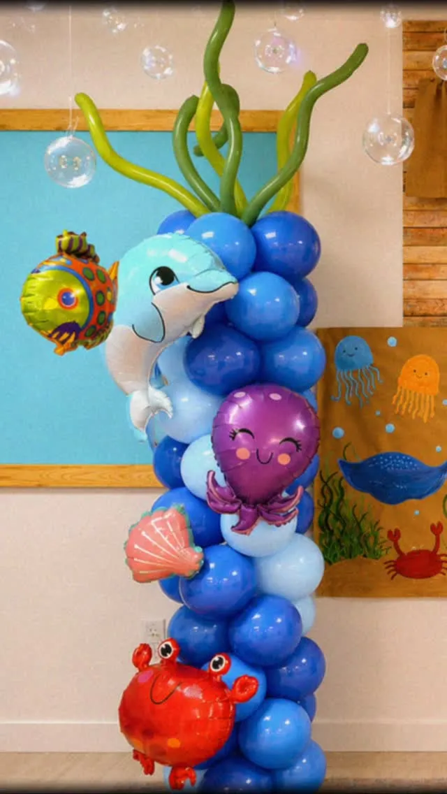 Blue balloon column decorated with sea creature balloons